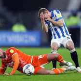 INJURY CONCERN: For Tom Lees, right. Picture: PA Wire.