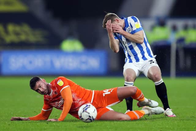 INJURY CONCERN: For Tom Lees, right. Picture: PA Wire.