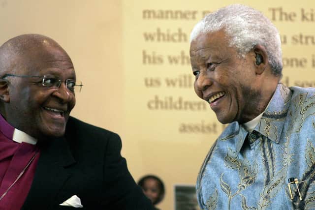 Archbishop Desmond Tutu, left, and President-elect Nelson Mandela confer during celebrations at a rally held in Soweto, South Africa, Sunday, May 8, 1994 in honor of national Thanksgiving Day. Tutu, South Africa's Nobel Peace Prize-winning activist for racial justice and LGBT rights and the retired Anglican Archbishop of Cape Town, has died at the age of 90, it was announced on Sunday, Dec. 26, 2021. An uncompromising foe of apartheid, South Africa's brutal regime of oppression again the Black majority, Tutu worked tirelessly, but non-violently, for its downfall.