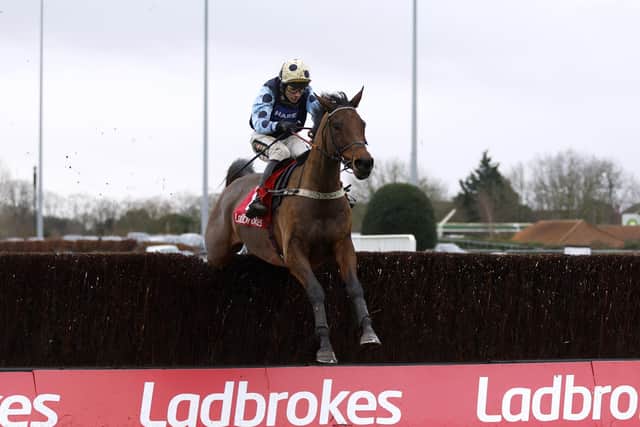 Edwardstone ridden by jockey Tom Cannon on their way to winning the Ladbrokes Wayward Lad Novices' Chase (Grade 2) during Desert Orchid Chase Day of the Ladbrokes Christmas Festival at Kempton Park.