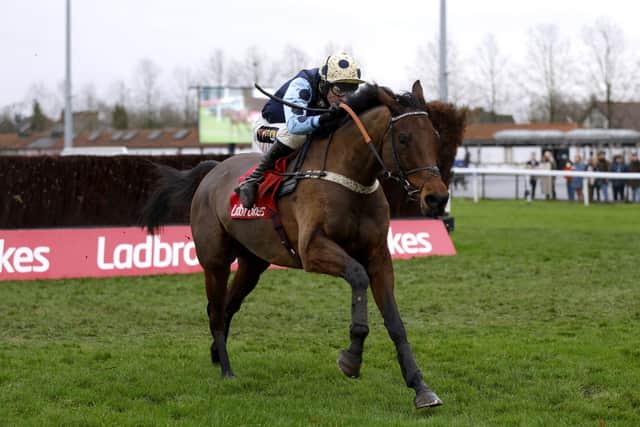 Edwardstone ridden by jockey Tom Cannon on their way to winning the Ladbrokes Wayward Lad Novices' Chase (Grade 2) during Desert Orchid Chase Day of the Ladbrokes Christmas Festival at Kempton Park.