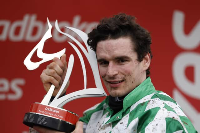 Jockey Danny Mullins celebrates after ridding Tornado Flyer to victory in the Ladbrokes King George VI Chase.