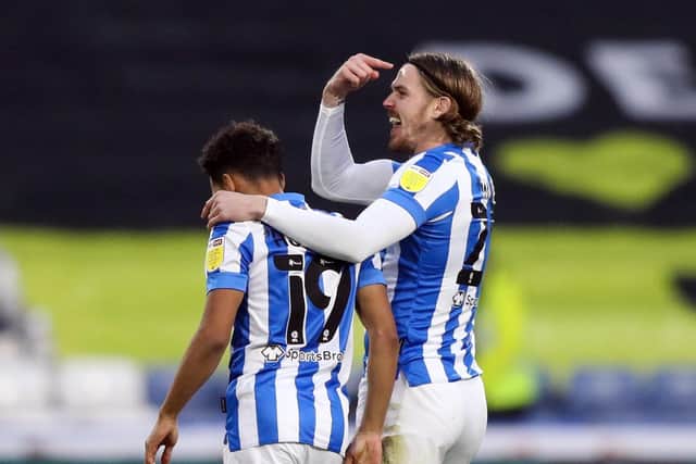 Huddersfield Town's Danny Ward (right) celebrates scoring their side's first goal against Blackpool at the John Smith's Stadium. Picture: Isaac Parkin/PA