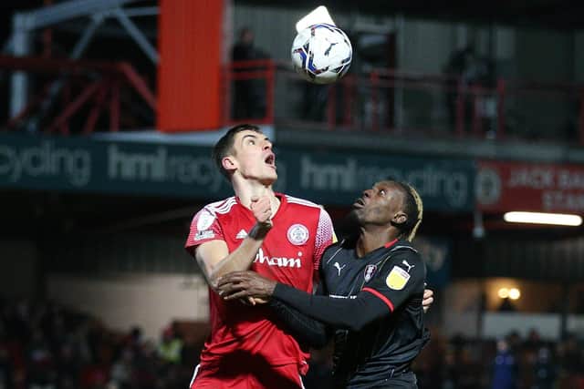 Eyes on the ball: Accrington Stanley's Ross Sykes (left) and Rotherham United's Freddie Ladapo. Picture: Nigel French/PA Wire.