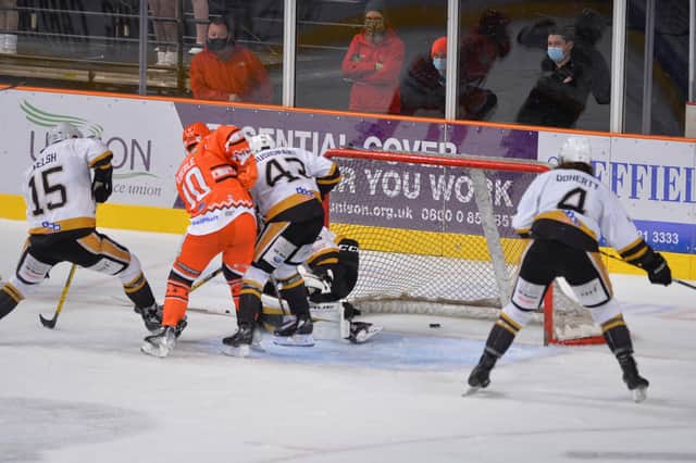 Tanner Eberle forces the ouck home to make it 4-2 to Sheffield Steelers over Nottingham Panthers on Boxing Day. Picture courtesy of Dean Woolley/EIHL.
