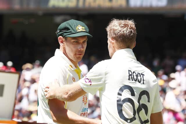 Well bowled: Australia's Scott Boland is congratulated by Joe Root.