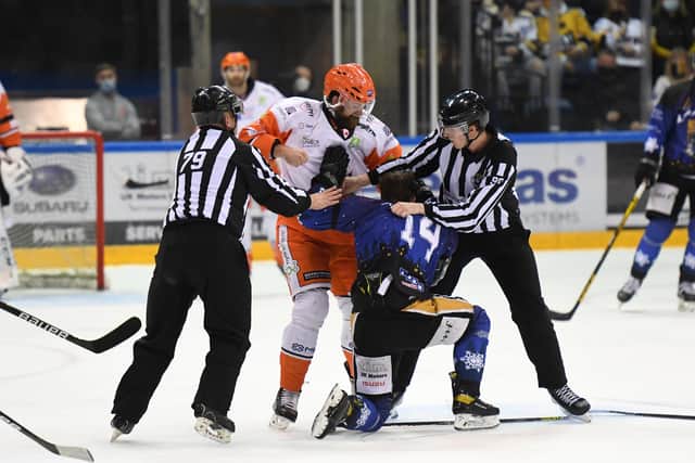 Sheffield Steelers' John Armstrong gets to grips with Nottingham Panthers' Jordan Kelsall in the first period on Monday. Picture: Karl Denham/EIHL.