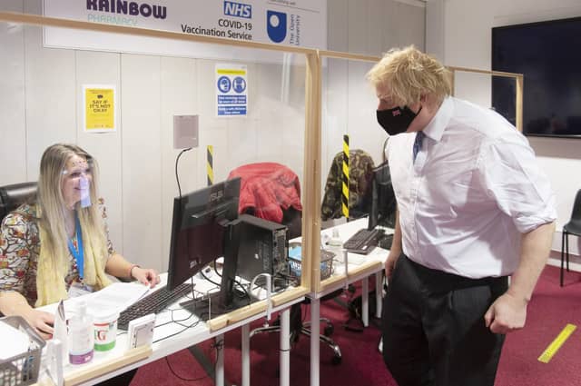 Prime Minister Boris Johnson during a visit to a Covid vaccination centre at the Rainbow Pharmacy in the Open University Campus, Walton Hall, Milton Keynes.