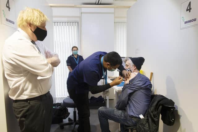Prime Minister Boris Johnson during a visit to a Covid vaccination centre at the Rainbow Pharmacy in the Open University Campus, Walton Hall, Milton Keynes.