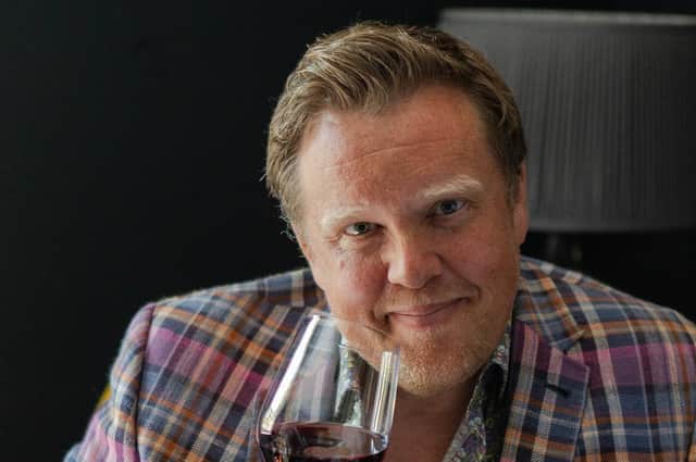 Olly Smith enjoying a glass of red wine. Picture: Catherine Benson.