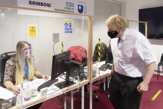 Prime Minister Boris Johnson during a visit to a Covid vaccination centre at the Rainbow Pharmacy in the Open University Campus, Walton Hall, Milton Keynes, Buckinghamshire