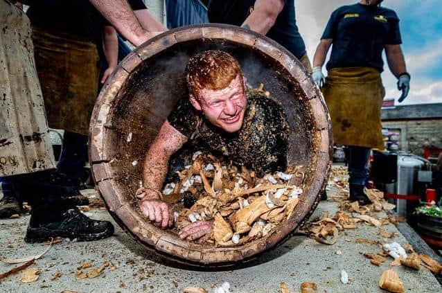 Theakston's Brewery apprentice cooper Euan Findlay during the barrel rolling ceremony