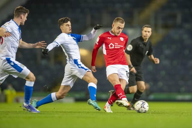 Barnsley's Josh Benson in possession from Blackburn Rovers Lewis Travis at Ewood Park. Picture: Tony Johnson
