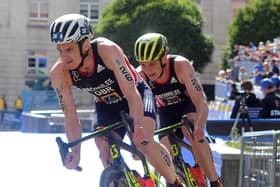 Jonny Brownlee leads his brother Alistair on the bike in the Elite Mens Race through Millennium Square. Jonny hopes to be back in 2022 (Picture: Tony Johnson)