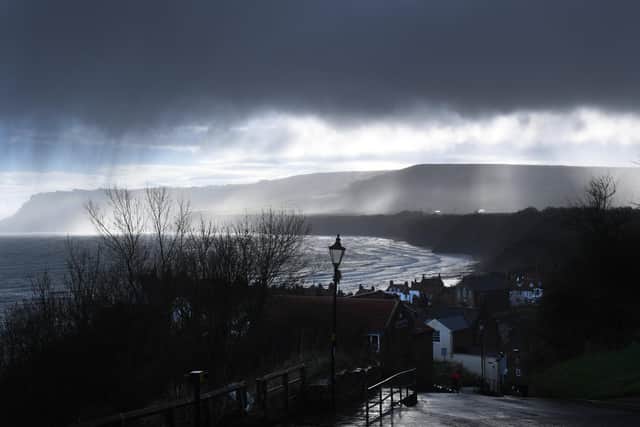 Light beyond the storm clouds at Robin Hood's Bay. Picture: Simon Hulme.