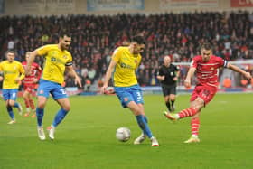 Doncaster captain Tommy Rowe shoots through a sea of Sunderland legs on Monday (Picture: Steve Riding)