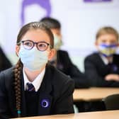 Children wearing facemasks during a lesson at Outwood Academy in Woodlands, Doncaster in Yorkshire in March 2021.