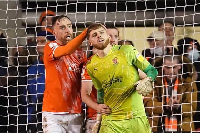 Blackpool goalkeeper Daniel Grimshaw (right) is congratulated by team-mate Richard Keogh after making a save from Hull City's Randell Williams late in the game (Picture: Martin Rickett/PA Wire)