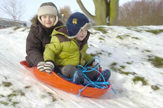 Owen Hallgarth, six, and Ellis Hallgarth, four, sledging near Sleaford Leisure Centre.