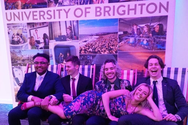 Students from the University of Brighton posed for photos on deckchairs and a replica Brighton beach inside The Brighton Centre
