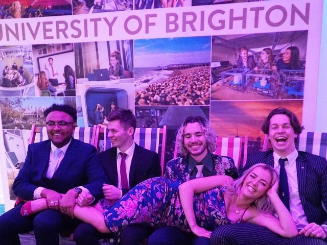 Students from the University of Brighton posed for photos on deckchairs and a replica Brighton beach inside The Brighton Centre