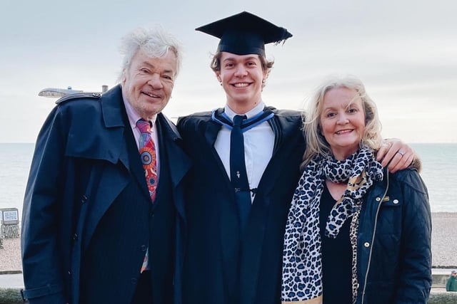 Graduate Alex Witty with his parents on Brighton seafront