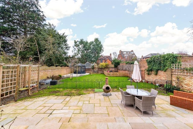 The west facing rear garden extends to over 80ft, is walled on all sides and has been recently landscaped. It includes a shaped terrace and outdoor entertaining area, a slope for lawnmower access and a pergola with climbing roses