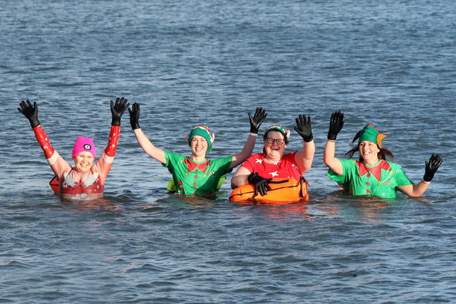 (L-R) Jackie Wood, Donna Sinclair, Pam Williamson and Julie McCready in the water at Crawfordsburn on the first day of 2022.

Photograph By Declan Roughan / Press Eye