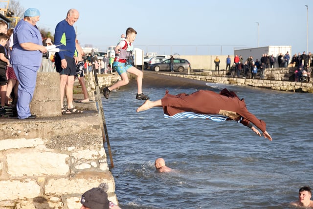 Making a splash for the 50th year of New Year's Day swims at Carnlough harbour.  Picture: Stephen Davison / Pacemaker.