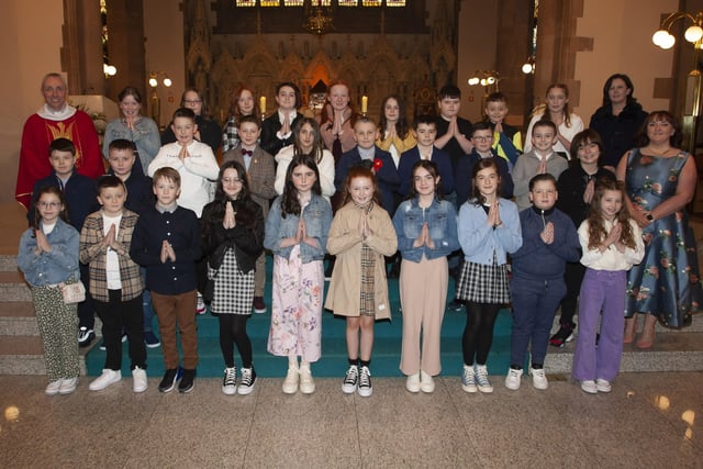 Children from St. Anne's Primary School who received the Sacrament of Confirmation from Fr. Paul Farren at St. Eugene's Cathedral on Thursday. Included in photo are Mrs. Eilis McGuinness, Principal and Mrs. Emma Meehan, class teacher. (Photo: Jim McCafferty Photography)