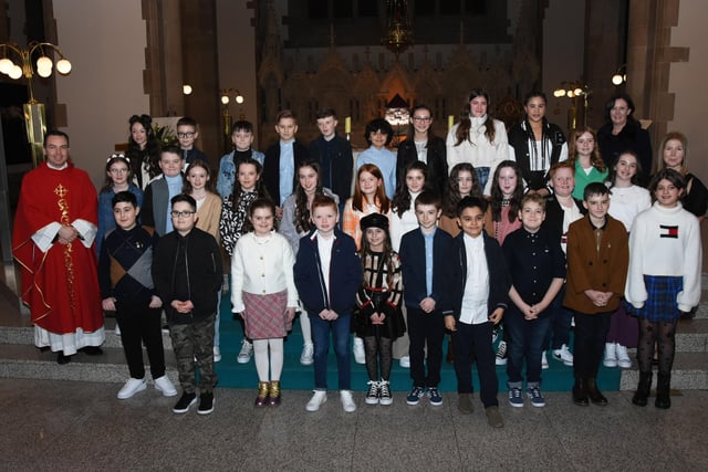 Children from St. Anne's Primary School who received the Sacrament of Confirmation from Fr. Paul Farren at St. Eugene's Cathedral on Thursday. Included in photo are Mrs. Eilis McGuinness, Principal and Mrs. Suzanne McRory, class teacher. (Photo: Jim McCafferty Photography)