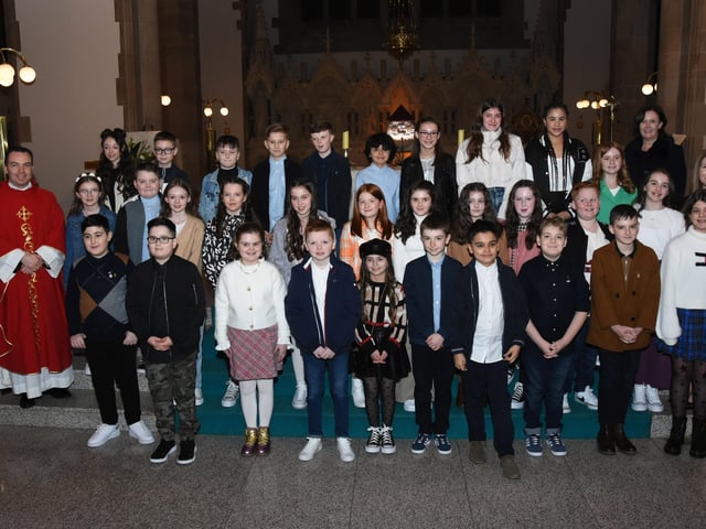 Children from St. Anne's Primary School who received the Sacrament of Confirmation from Fr. Paul Farren at St. Eugene's Cathedral on Thursday. Included in photo are Mrs. Eilis McGuinness, Principal and Mrs. Suzanne McRory, class teacher. (Photo: Jim McCafferty Photography)