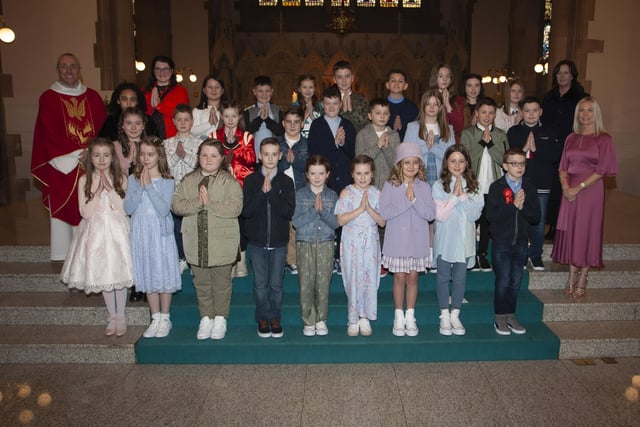 Children from St. Anne's Primary School who received the Sacrament of Confirmation from Fr. Paul Farren at St. Eugene's Cathedral on Thursday. Included in photo are Mrs. Eilis McGuinness, Principal and Mrs. Jennifer Morrison, class teacher. (Photo: Jim McCafferty Photography)