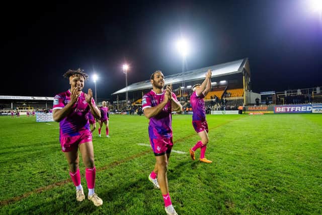 Huddersfield's Hugo Salabio and Leroy Cudjoe thank the fans after victory against Castleford. (Photo: Allan McKenzie/SWpix.com)