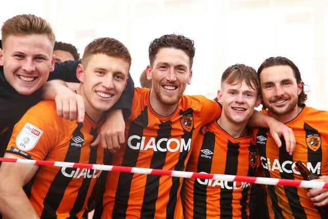 LEAGUE ONE WINNERS: Keane Lewis-Potter (second from right) and Lewie Coyle (far right) celebrate Hull City winning the third-tier title (Image: Joe Portlock/Getty Images)