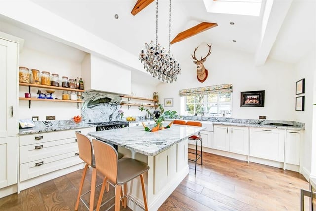 The kitchenis full of natural light and looks over the gardens.  Appliances include a rangemaster oven with warming ovens, five ring gas hob and extractor. The kirchen ois also home to a wod-burning stove.
