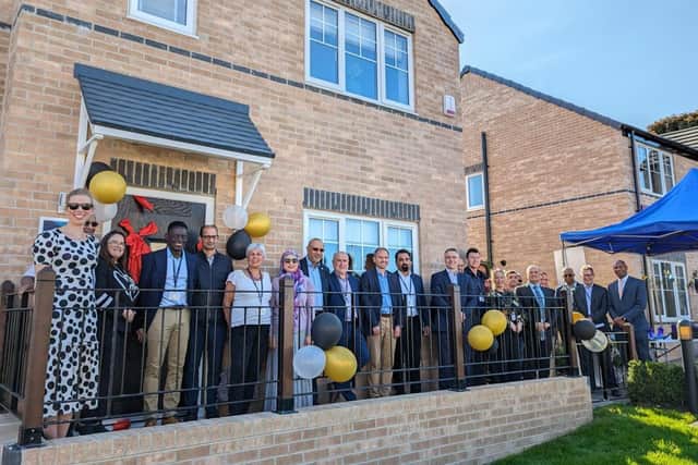 MHA tenants, Board members, staff and project partners at the officlal opening of the association’s new 20-unit affordable homes