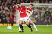 WHY IT MATTERS: Leeds United's Ethan Ampadu battles for the ball with Manchester United's Bruno Fernandes at Old Trafford in April last season. The two rivals meet again on Sunday at Elland Road. Picture: Martin Rickett/PA
