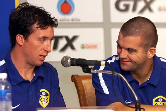 BANGKOK - July 28: Robbie Fowler and Dominic Matteo of Leeds United talk to each other during a press conference at the Merchant Court Hotel in Bangkok, as Leeds prepare for a pre season friendly with Thailand on Tuesday the 30th during their Far East Tour. (Photo by Stanley Chou/Getty Images)