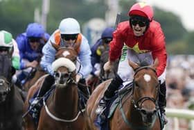 MAGIC MOMENT: Jason Hart riding Highfield Princess (red) win The Coolmore Wootton Bassett Nunthorpe Stakes at York Racecourse in August last year. Picture: Alan Crowhurst/Getty Images