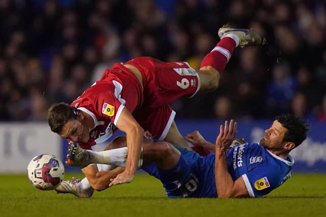 TUSSLE: Middlesbrough's Dael Fry (left) and Birmingham City's Lukas Jutkiewicz battle for the ball at St. Andrew's, Birmingham. Picture: Tim Goode/PA.