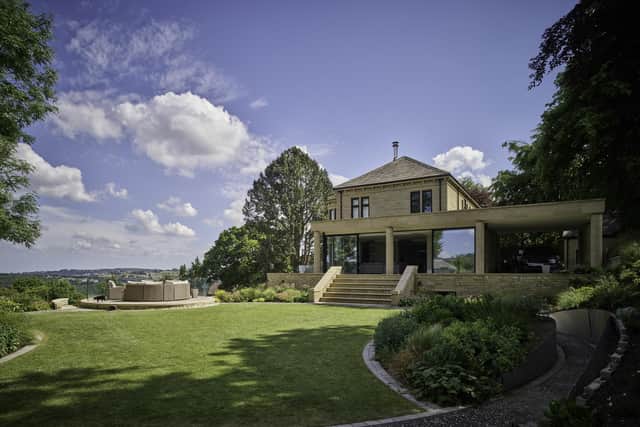 The house has sensational, long-range views and the circular lawn reflects the property's original rotunda.