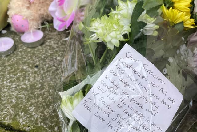 Flowers are left outside the Hessle Road branch of Legacy Independent Funeral Directors in Hull.