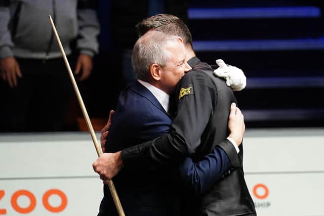 Brendan Moore hugs Mark Selby after his 147.