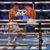 LEEDS, ENGLAND - SEPTEMBER 04: Mauricio Lara and Josh Warrington exchange punches during the Featherweight fight between Mauricio Lara and Josh Warrington at Emerald Headingley Stadium on September 04, 2021 in Leeds, England. (Photo by George Wood/Getty Images)