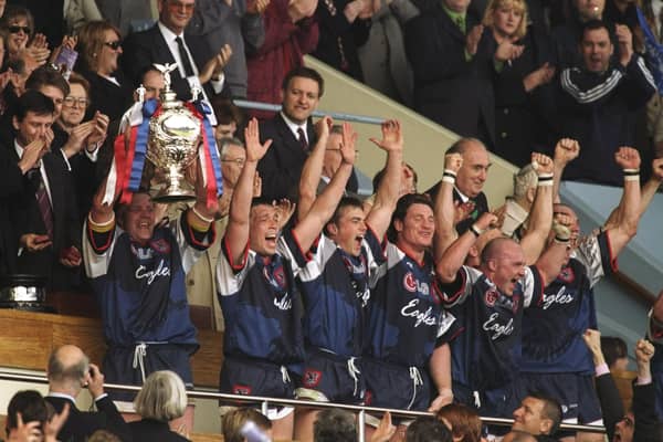That winning feeling: Sheffield Eagles captain Paul Broadbent, with Mark Aston on his right, lifts the trophy aloft after the Silk Cut Challenge Cup final against Wigan Warriors at Wembley Stadium in London in 1998 (Picture: Mike Hewitt/Allsport)