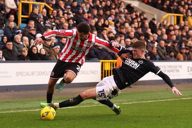 LONDON, ENGLAND - JANUARY 07: Iliman Ndiaye of Sheffield United is challenged by Charlie Cresswell of Millwall during the Emirates FA Cup Third Round match between Millwall FC and Sheffield United at The Den on January 07, 2023 in London, England. (Photo by Warren Little/Getty Images)
