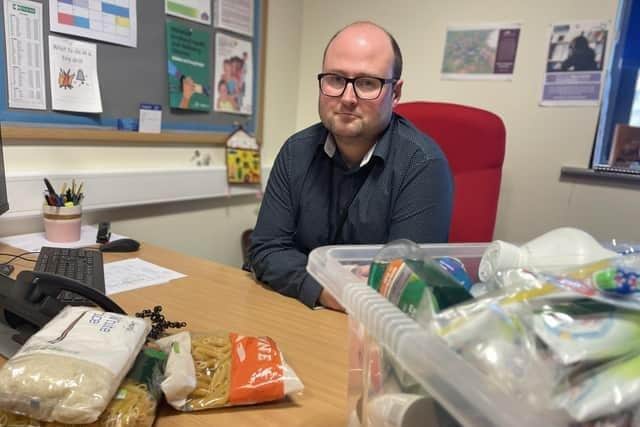 Andrew Carter started a discreet food bank from his office