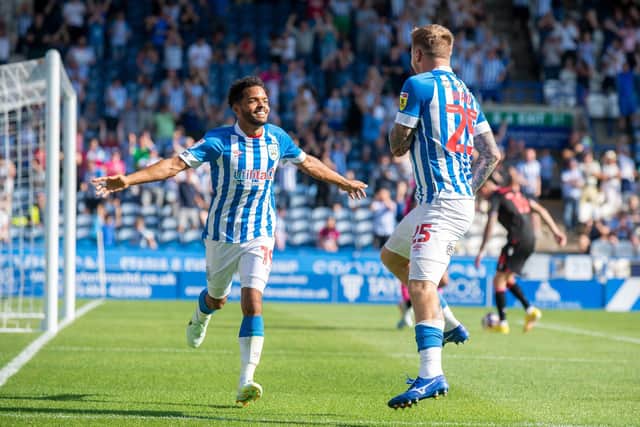 FORGOTTEN FEELING: Duane Holmes celebrates a goal for Huddersfield Town's Danny Ward in August
