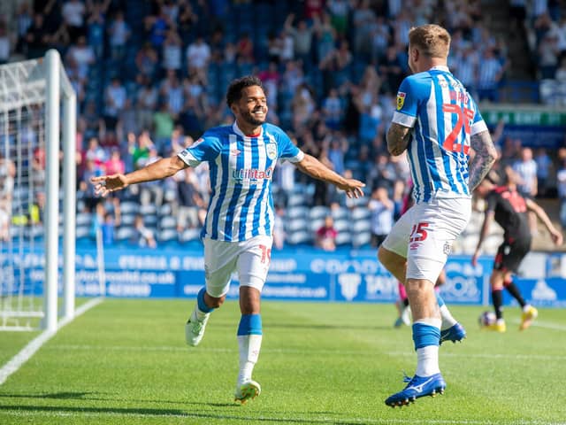 FORGOTTEN FEELING: Duane Holmes celebrates a goal for Huddersfield Town's Danny Ward in August